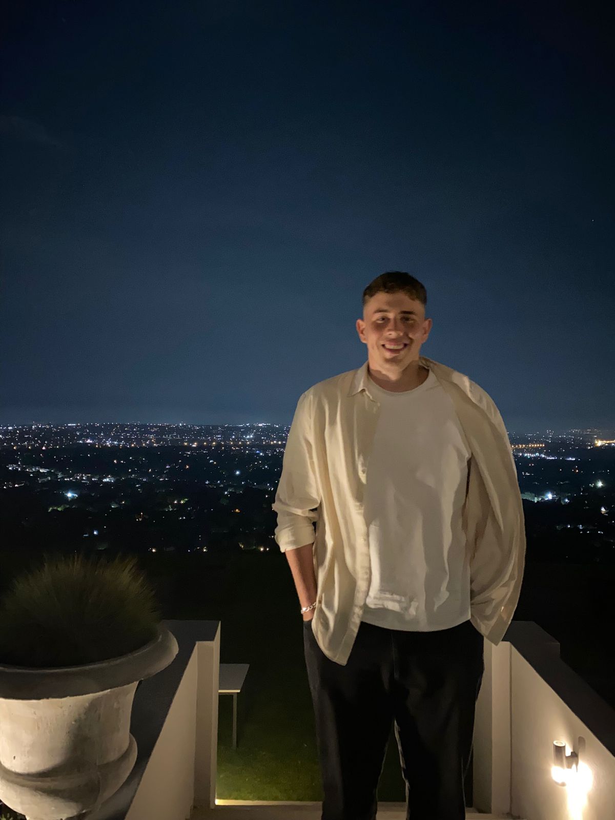 Rooftop nights, the whole city glowing below.
